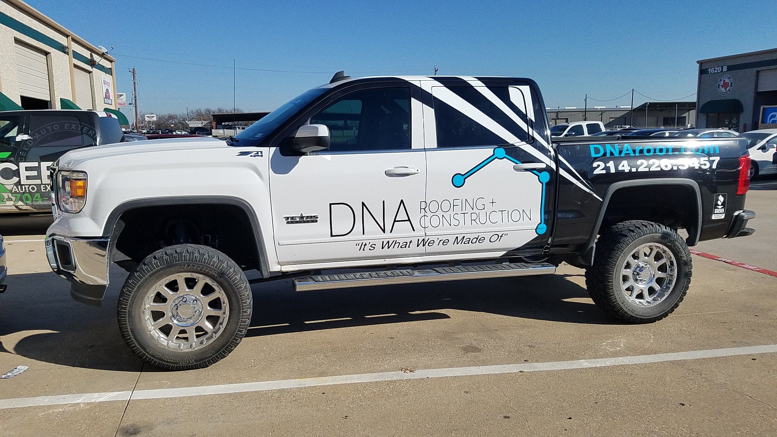 white and black truck wrap for roofing, orlando, altamonte springs
