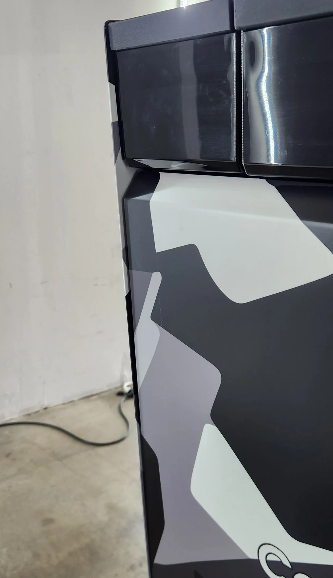 Close-up of wrapped Cybertruck door and panel edges